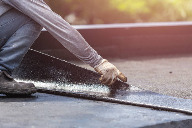 Professional Basement Waterproofing technician working in Hartford, IL